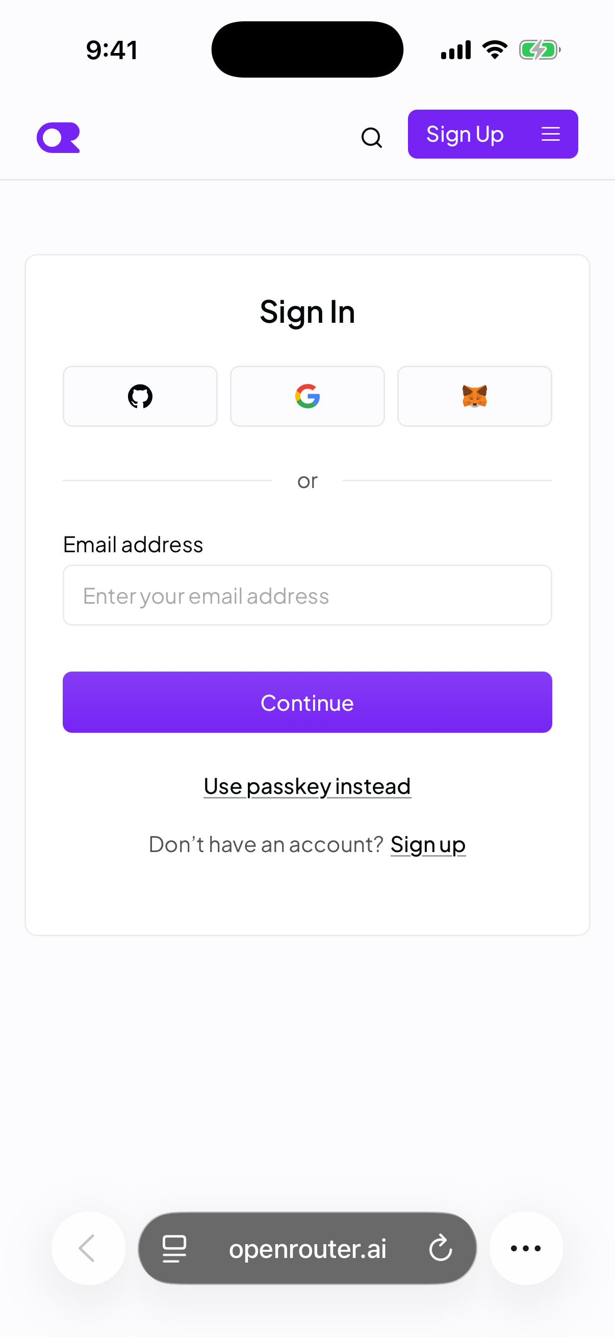 OpenRouter's Sign In card in Safari on an iPhone, with GitHub, Google, and MetaMask buttons, an email address field, and a Use passkey instead link.